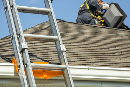 Extension ladder resting against Gutter Saver PRO